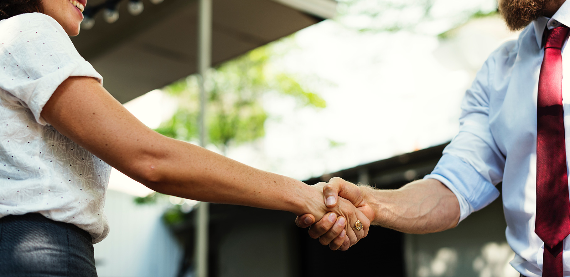 two people are shaking hands